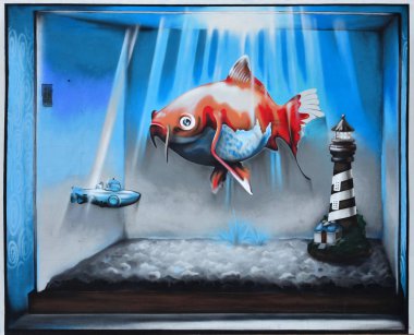 Ayrıntılı görüntü renk grafiti çizim. Boyalı sualtı bathyscaphe ile arka plan Street sanat arka plan veya odaya yüzen denizaltı ve turuncu balık