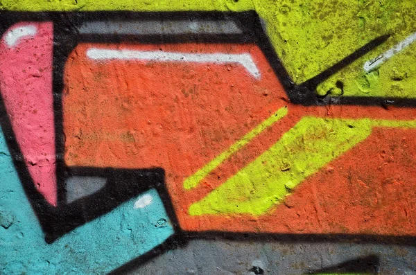 Street art. Colorful graffiti on the wall. Fragment for background. Abstract detail of a graffiti