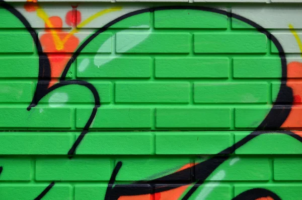 Street art. Colorful graffiti on the wall. Fragment for background. Abstract detail of a graffiti