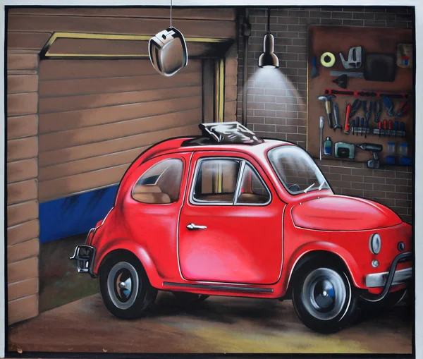 Detailed image of color graffiti drawing. Background Street art background with painted red car in the garage