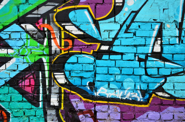 Детальное изображение цветного граффити. Фотография с улицы. Часть красочного шедевра профессионального граффити-художника

