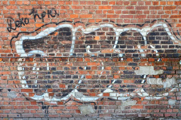 The texture of the wall with graffiti, which is depicted on it. The image of the whole and complete graffiti of the drawing as a resource for the design of 3D projects