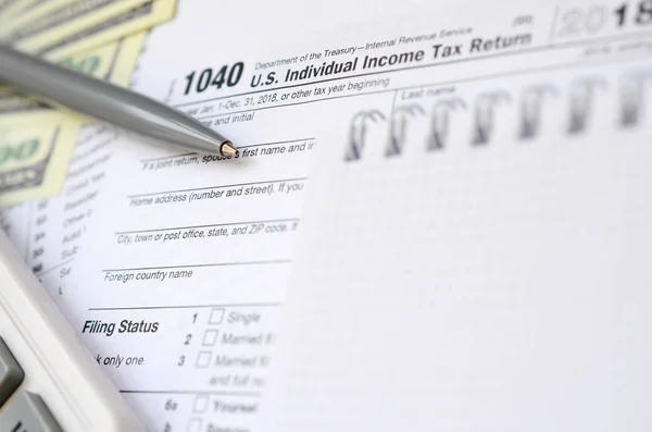 Pen Notebook Calculator Dollar Bills Lies Tax Form 1040 Individual — Stock Photo, Image