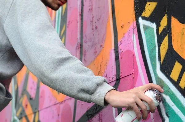 Young Guy Gray Hoodie Paints Graffiti Pink Green Colors Wall — Stock Photo, Image