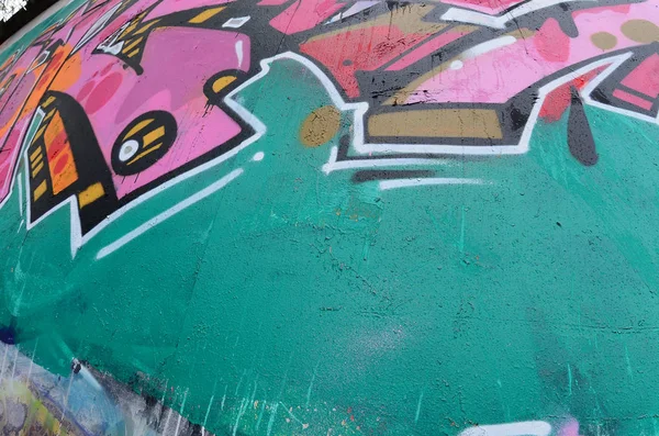 Fragment of a beautiful graffiti pattern in pink and green with a black outline. Street art background image