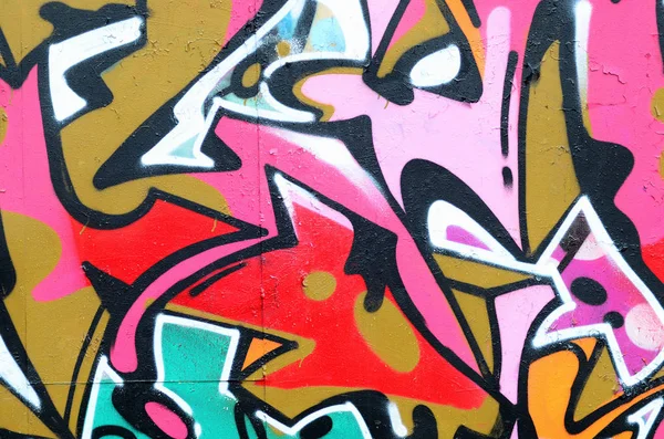 ピンクの美しいグラフィティ パターンのフラグメントと黒の縁取りの緑 ストリート アートの背景画像 — ストック写真