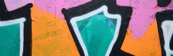 Fragment of a beautiful graffiti pattern in pink and green with a black outline. Street art background image