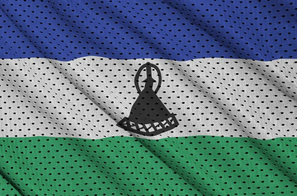 Lesotho flag printed on a polyester nylon sportswear mesh fabric — Stock Photo, Image