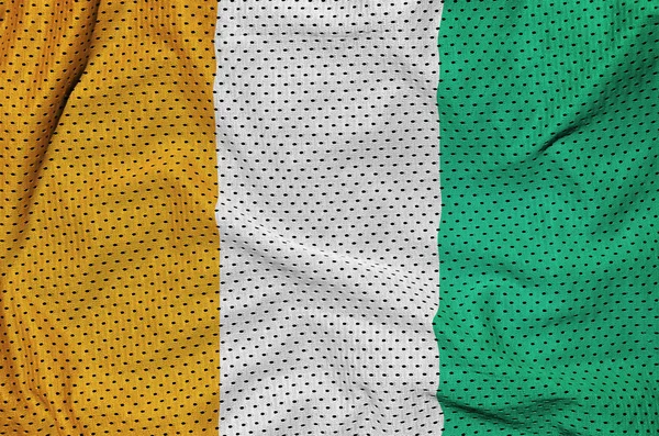 Elfenbenskusten flagga tryckt på en polyester nylon sportkläder mesh fa — Stockfoto