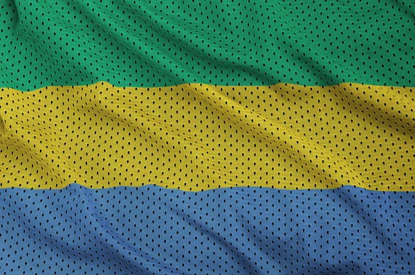 Gabon flag printed on a polyester nylon sportswear mesh fabric w — Stock Photo, Image