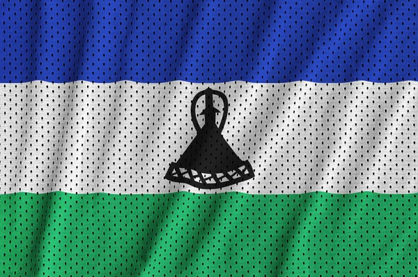 Lesotho flag printed on a polyester nylon sportswear mesh fabric — Stock Photo, Image