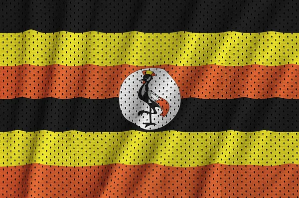 Uganda zászló nyomtatott-ra egy poliészter nylon sportruházat háló szerkezet — Stock Fotó