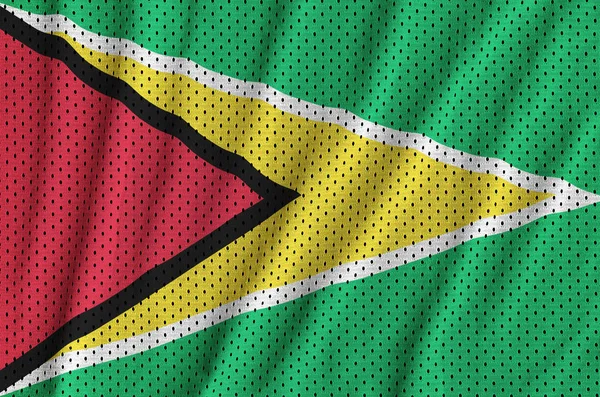 Guyana flag printed on a polyester nylon sportswear mesh fabric — Stock Photo, Image