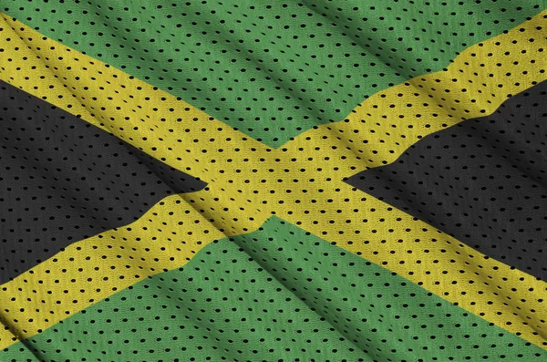 Jamaicai zászló nyomtatott-ra egy poliészter nylon sportruházat háló szerkezet — Stock Fotó