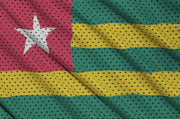 Togo flag printed on a polyester nylon sportswear mesh fabric wi — Stock Photo, Image