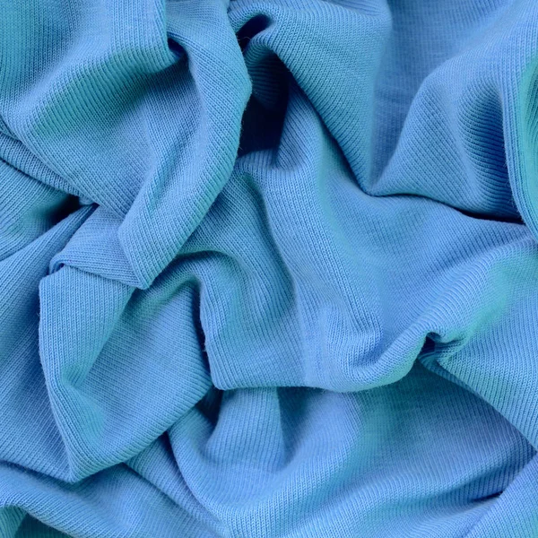The texture of the fabric in blue color. Material for making shirts and blouses — Stock Photo, Image