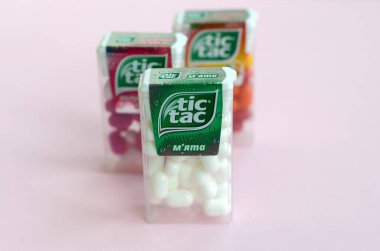 Many Tic Tac Candy packages close up. Tic tac is popular due its minty fresh taste and easy to carry. Hard mints produced by Ferrero since 1968 clipart
