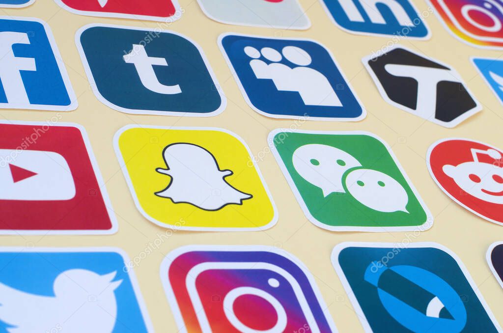 KHARKOV, UKRAINE - OCTOBER 17, 2019: Many paper icons with logo of most popular social networks and smartphone apps for chat and conversations online