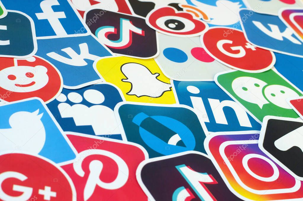 KHARKOV, UKRAINE - OCTOBER 17, 2019: Many paper icons with logo of most popular social networks and smartphone apps for chat and conversations online