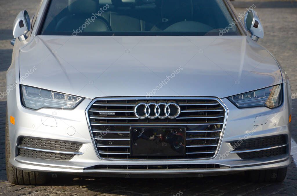 KHARKOV, UKRAINE - OCTOBER 20, 2019: Audi a6 quattro logo and front view. Audi AG is a German automobile manufacturer and member of the Volkswagen Group