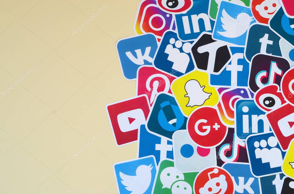 KHARKOV, UKRAINE - OCTOBER 17, 2019: Many paper icons with logo of most popular social networks and smartphone apps for chat and conversations online
