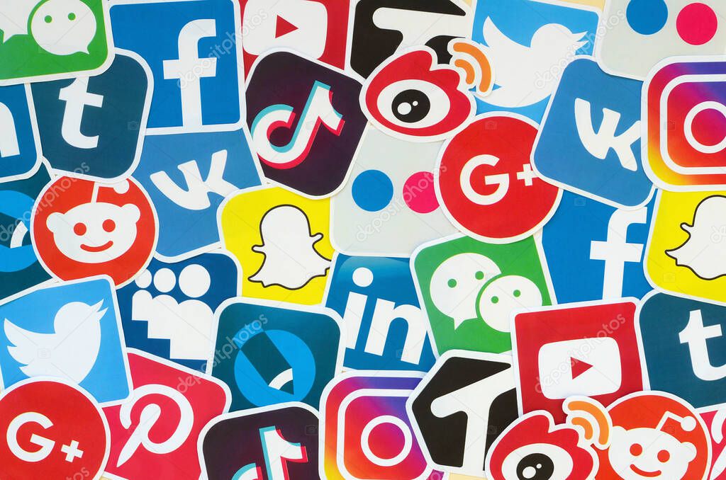 KHARKOV, UKRAINE - OCTOBER 17, 2019: Many paper icons with logo of most popular social networks and smartphone apps for chat and conversations online