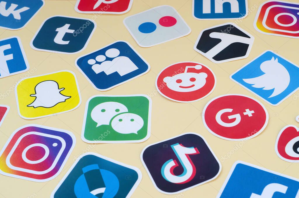 KHARKOV, UKRAINE - OCTOBER 17, 2019: Many paper icons with logo of most popular social networks and smartphone apps for chat and conversations online