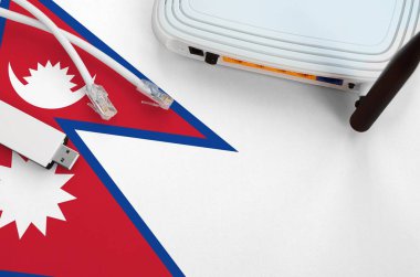 Masada internet rj45 kablo, kablosuz usb wi-fi adaptör ve yönlendirici ile Nepal bayrağı tasvir edilmiştir. İnternet bağlantısı kavramı