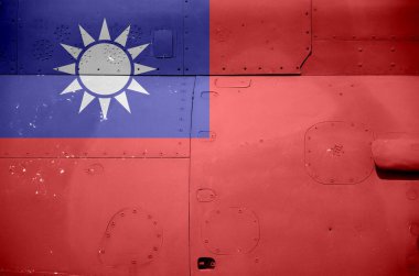 Taiwan flag depicted on side part of military armored helicopter close up. Army forces aircraft conceptual background clipart