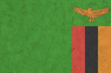 Zambiya bayrağı eski kabartma duvarda parlak boya renkleriyle resmedilmiş. Kabataslak arkaplanda desenli pankart