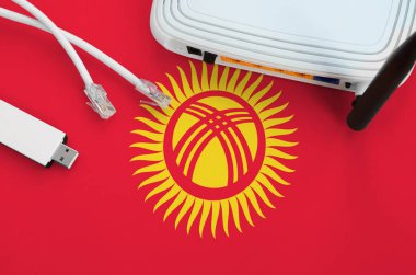 Kırgızistan bayrağı internet rj45 kablo, kablosuz usb wi-fi adaptör ve yönlendirici ile resmedildi. İnternet bağlantısı kavramı