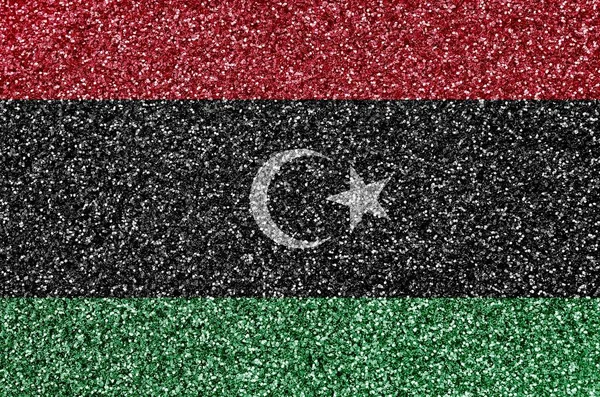 Libya flag depicted on many small shiny sequins. Colorful festival background for disco party