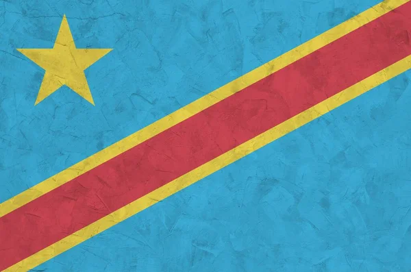 刚果民主共和国的国旗在旧的浮雕石墙上涂上鲜艳的油漆 粗糙背景的纹理横幅 — 图库照片