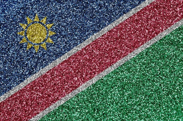 Namibia flag depicted on many small shiny sequins. Colorful festival background for disco party