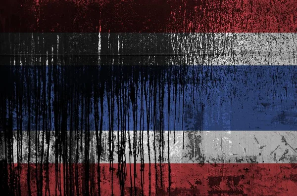 Thailand flag depicted in paint colors on old and dirty oil barrel wall close up. Textured banner on rough background