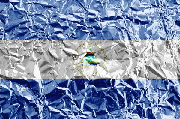 Nikaragua Bayrağı Parlak Buruşuk Alüminyum Folyoyla Boyanmış Kabataslak Arkaplanda Desenli — Stok fotoğraf