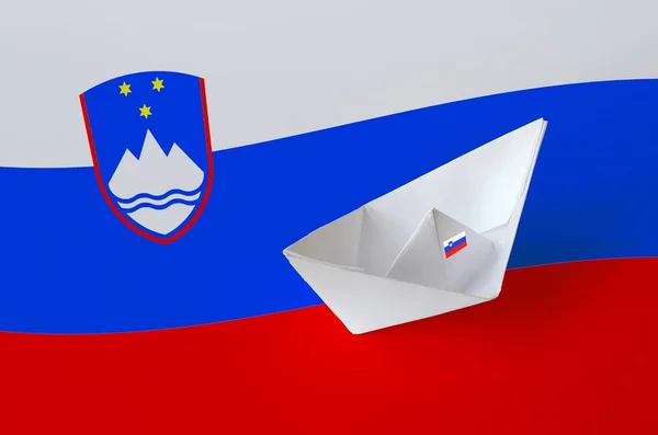 Slovenia flag depicted on paper origami ship closeup. Oriental handmade arts concept