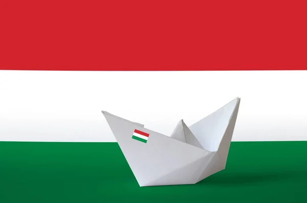 Hungary flag depicted on paper origami ship closeup. Oriental handmade arts concept