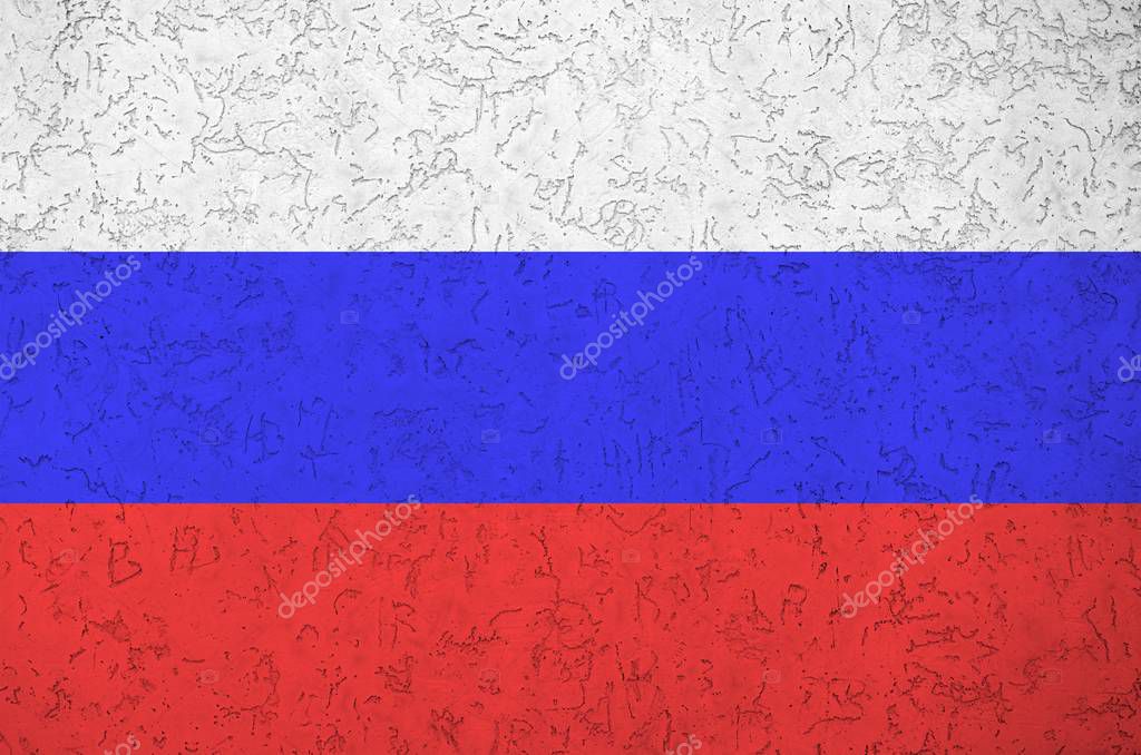 Russia flag depicted in bright paint colors on old relief plastering wall close up. Textured banner on rough background