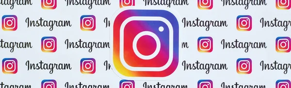 Instagram pattern printed on paper with small instagram logos and inscriptions. Instagram is American photo and video-sharing social networking service owned by Facebook — Stock Photo, Image