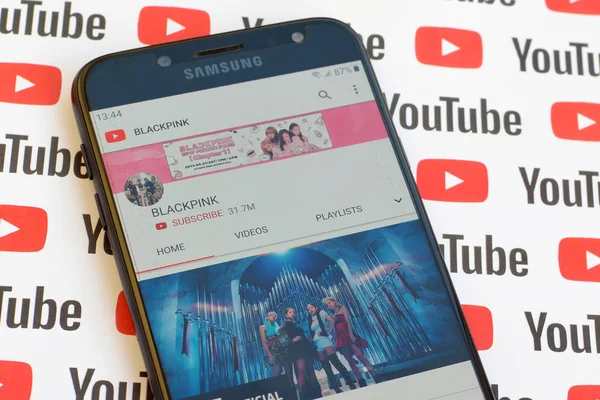 Blackpink official youtube channel on smartphone screen on paper — Stock Photo, Image