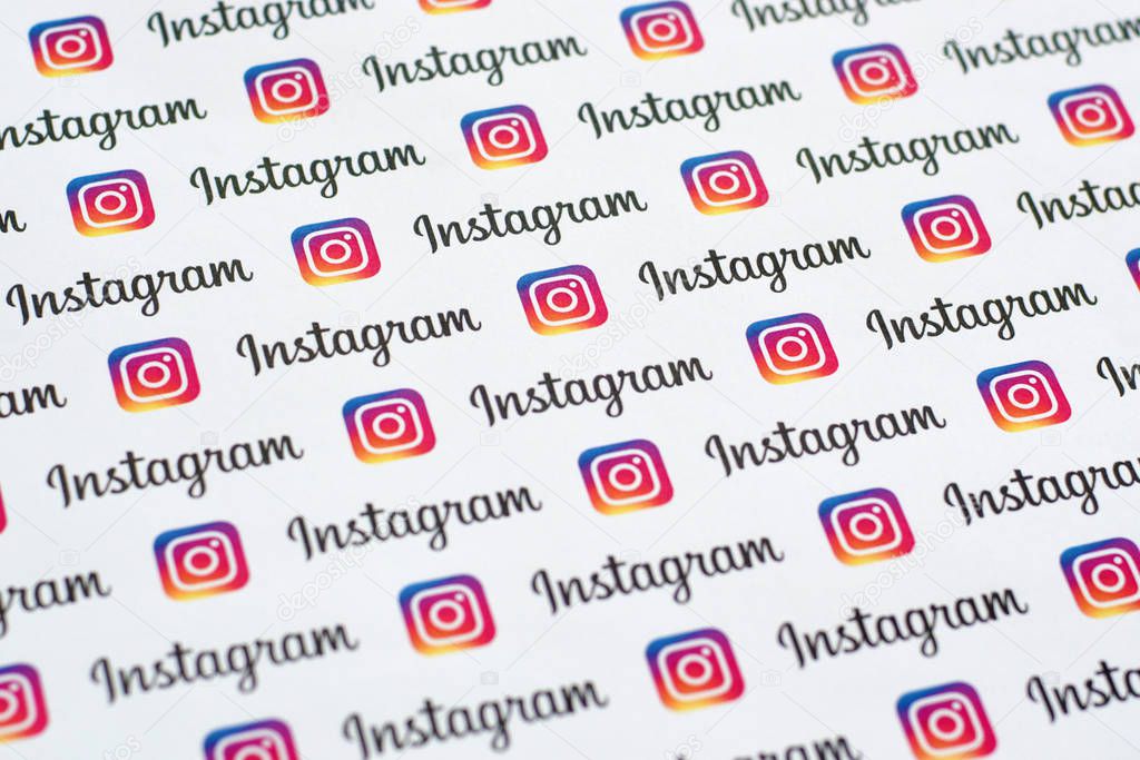 NY, USA - DECEMBER 5, 2019: Instagram pattern printed on paper with small instagram logos and inscriptions. Instagram is American photo and video-sharing social networking service owned by Facebook