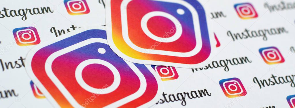 NY, USA - DECEMBER 5, 2019: Instagram pattern printed on paper with small instagram logos and inscriptions. Instagram is American photo and video-sharing social networking service owned by Facebook