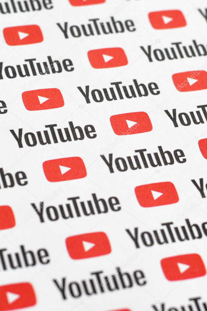 NY, USA - DECEMBER 5, 2019: Youtube pattern printed on paper with small youtube logos and inscriptions. YouTube is Google subsidiary and American most popular video-sharing platform
