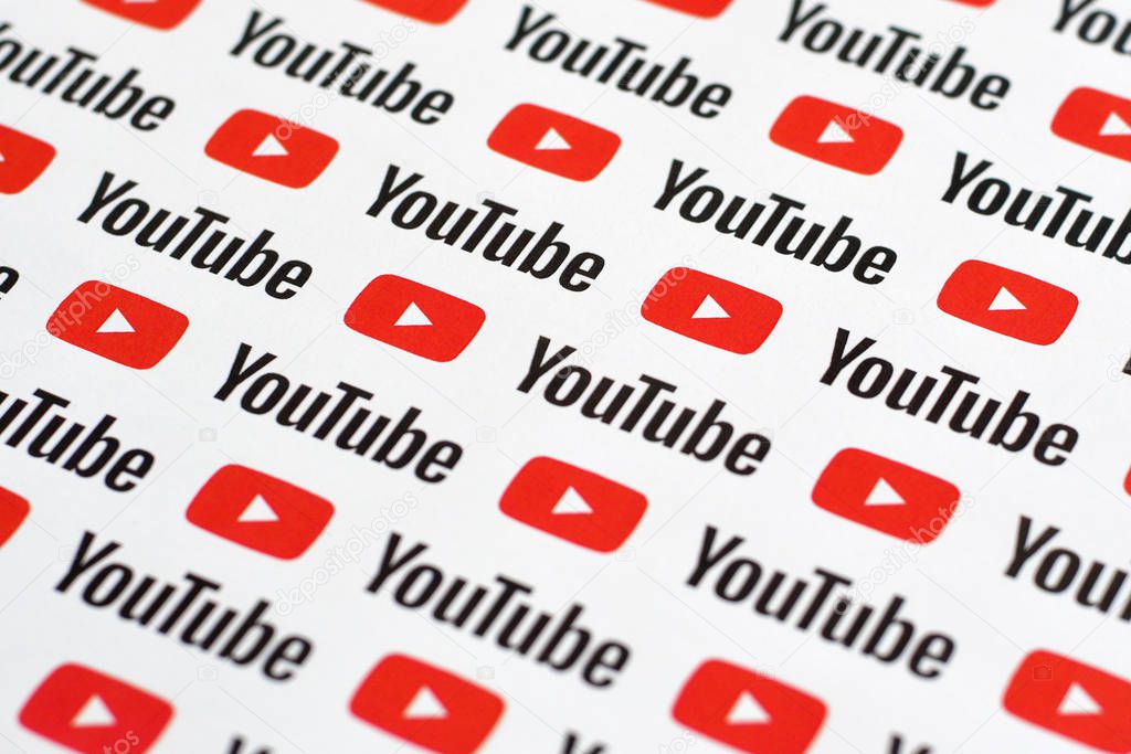 NY, USA - DECEMBER 5, 2019: Youtube pattern printed on paper with small youtube logos and inscriptions. YouTube is Google subsidiary and American most popular video-sharing platform