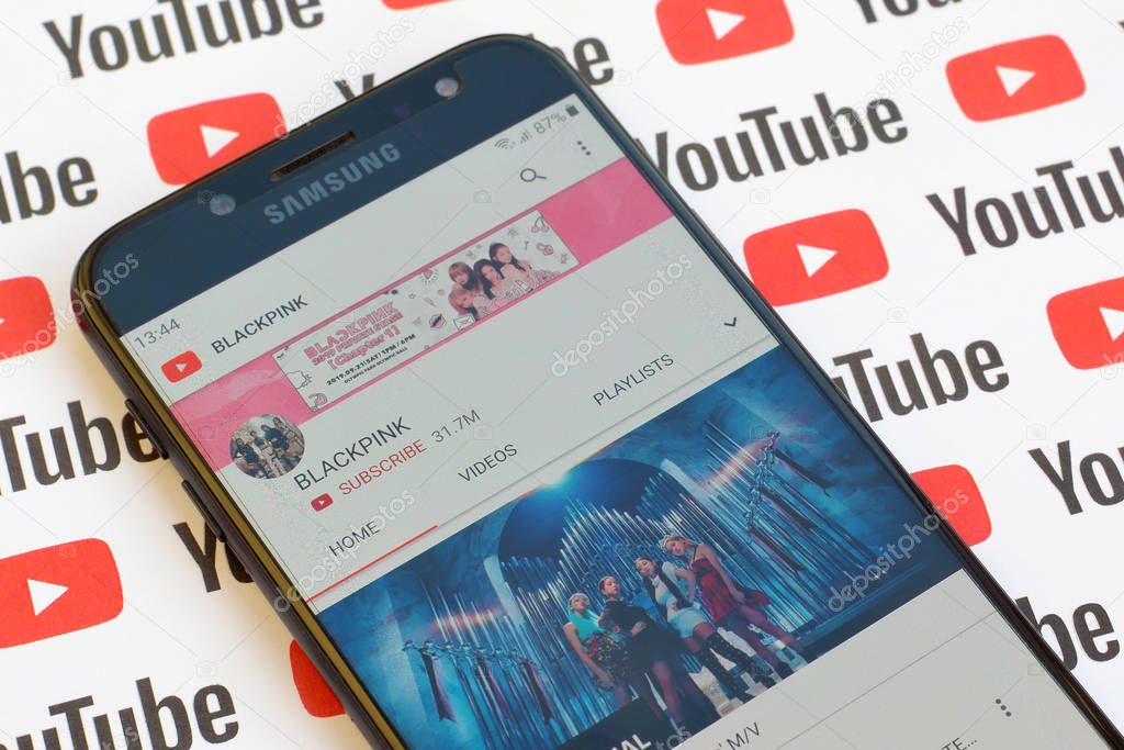 NY, USA - DECEMBER 4, 2019: Blackpink official youtube channel on smartphone screen on paper youtube background.