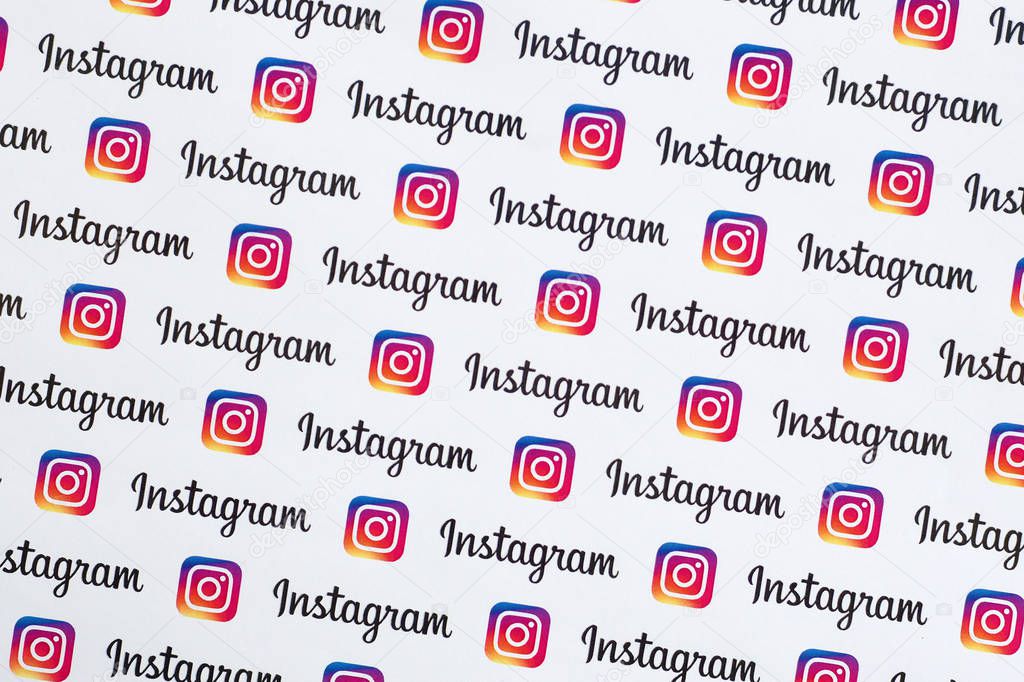 NY, USA - DECEMBER 5, 2019: Instagram pattern printed on paper with small instagram logos and inscriptions. Instagram is American photo and video-sharing social networking service owned by Facebook