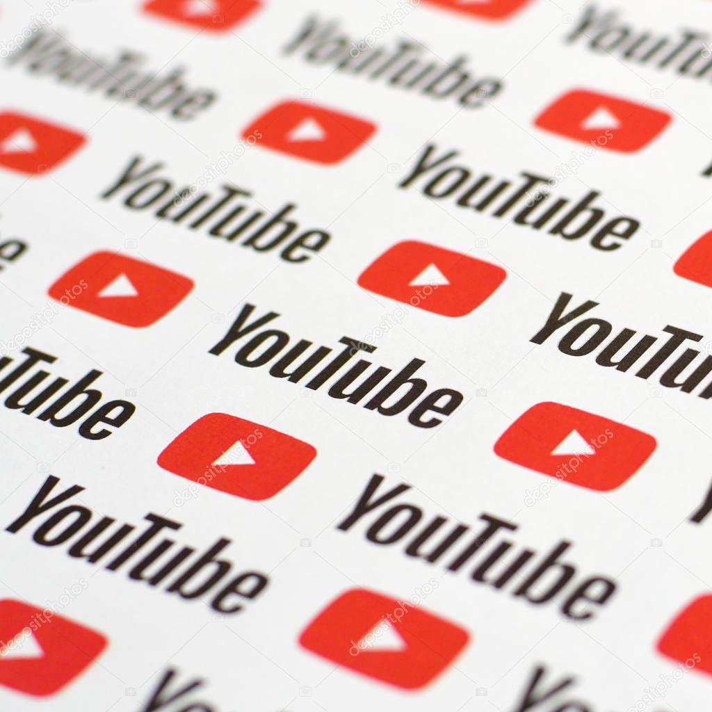 NY, USA - DECEMBER 5, 2019: Youtube pattern printed on paper with small youtube logos and inscriptions. YouTube is Google subsidiary and American most popular video-sharing platform