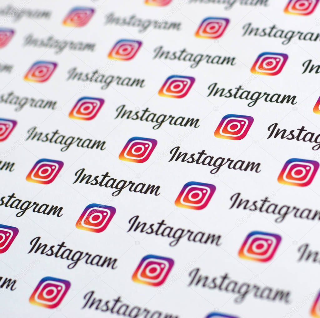 NY, USA - DECEMBER 5, 2019: Instagram pattern printed on paper with small instagram logos and inscriptions. Instagram is American photo and video-sharing social networking service owned by Facebook