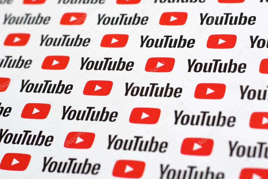 NY, USA - DECEMBER 5, 2019: Youtube pattern printed on paper with small youtube logos and inscriptions. YouTube is Google subsidiary and American most popular video-sharing platform